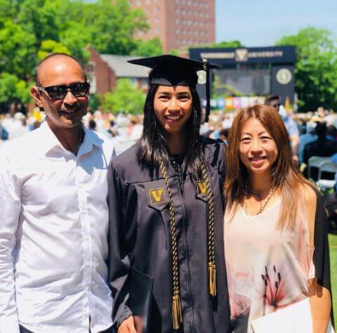 Astra Sharma with her parents on her graduation day.